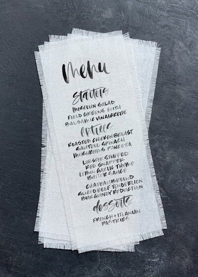 Calligraphy wedding menu printed on linen fabric