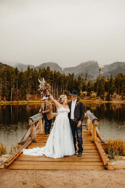 couple celebrating after their elopement ceremony in estes park