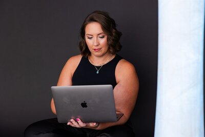 Self-esteem therapist taking notes on her laptop in Canon City