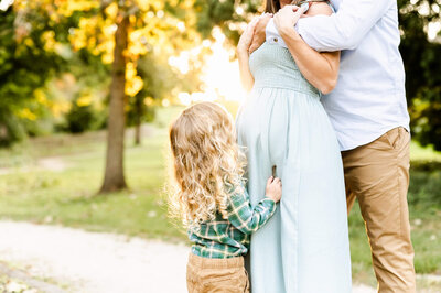 Chicago Family Photography sunset maternity session with young toddler at a park.