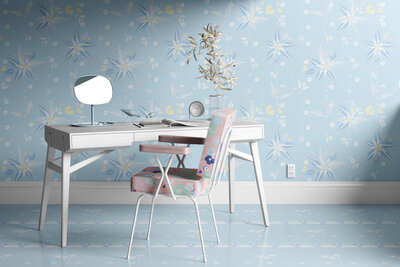 Desk in room with blue and white patterned wallpaper