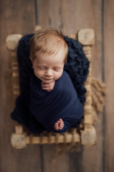 baby boy posed in tampa, fl newborn photography studio