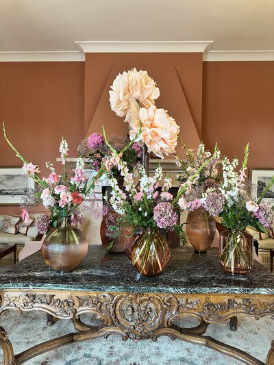 Historic table with fresh flower arrangements at Chateau Saint Martin in Vence France