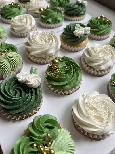 Orange olive oil cupcakes from Dip’d Desserts in Portland, Oregon, featuring a modern, luxurious design with a dried orange garnish, perfect for upscale events and celebrations.