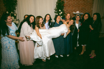 bride getting picked up bt friends and family