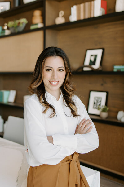 Woman standing smiling at camera