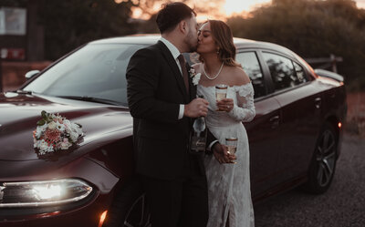 A photo of a bride and groom standing in Sedona red rocks for their elopement. Photo taken by Kollar photography Arizona Elopement Photographer