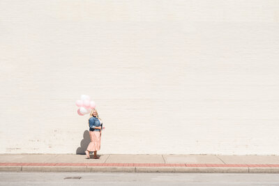 woman holding balloons