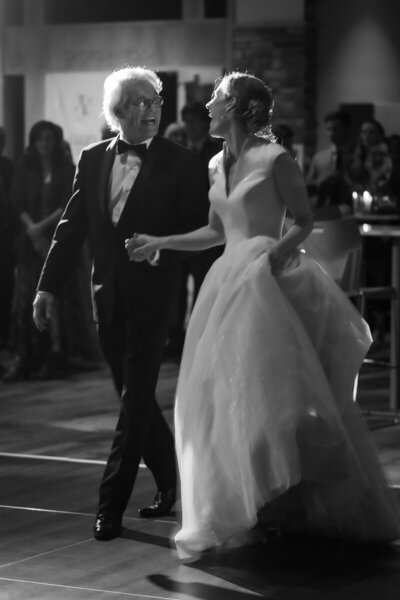 father leads daughter on dance floor at Alpine Ski Club wedding