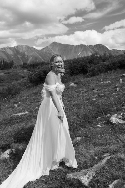 candid bride laughing at her destination wedding in Breckenridge Colorado 