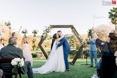 Bride and Groom share their first kiss at the San Juan Hills Golf Club wedding ceremony