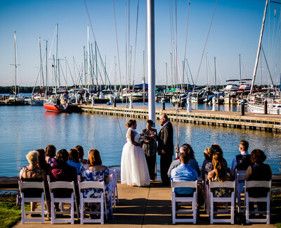 Wedding ceremony at the flagpole of the Erie Yacht Club