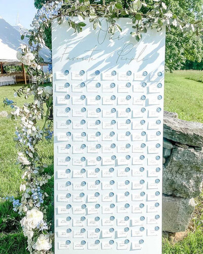 Seating chart with blue wax seals for wedding at Stone Acres Farm in Connecticut