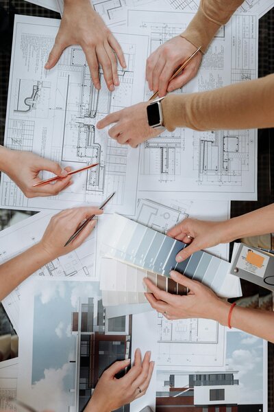 interior design meeting flatlay with blueprints and color palettes by Dana Triano Designs
