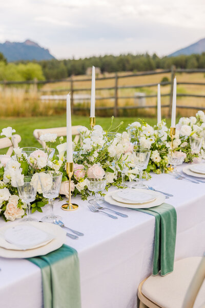 Beautiful tablescape set up at the Greystone Castle in Boulder, Colorado featuring pops of greens and pinks.
