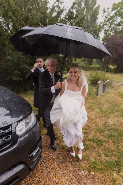 Wedding photographer captures couple taking a stroll hand in hand at their french chateau wedding.