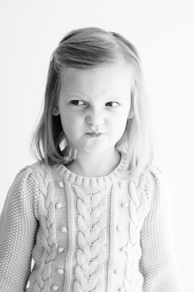 Black and white photo of girl making a funny face