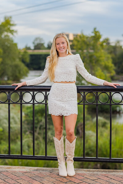 A girl taking her senior portrait in downtown Columbia, South Carolina