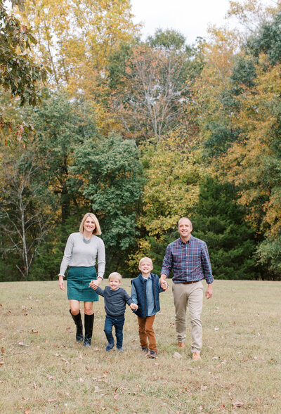 family walking for photos at Greenway Farms in Chattanooga