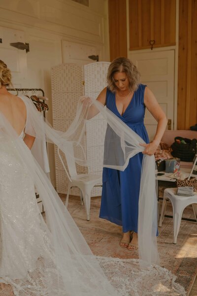 Mother helping her daughter get ready