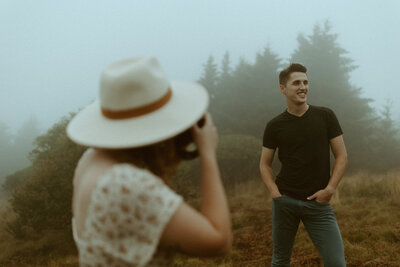 woman taking photo of man