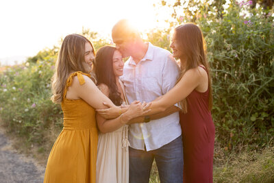 family outside near blackberry bushes photographed by family portrait photographer vancouver