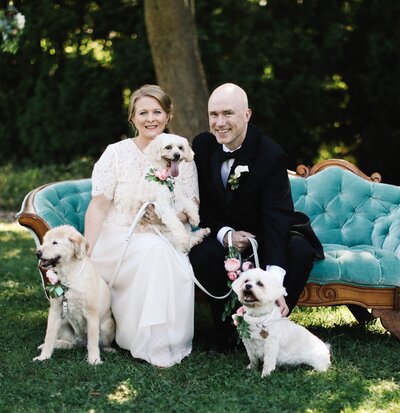 Couple at their wedding with their dogs