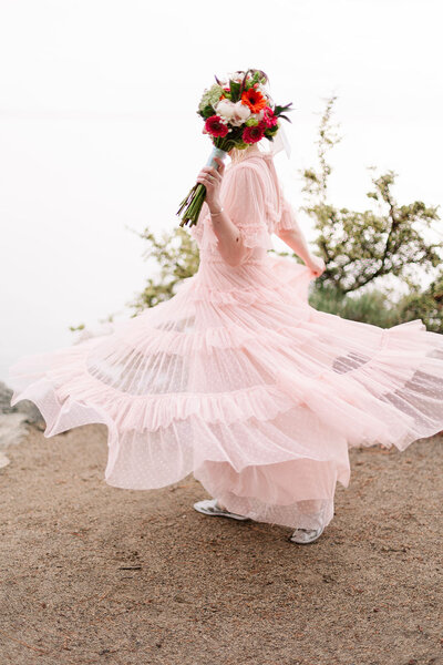 Bride twirls in her wedding gown