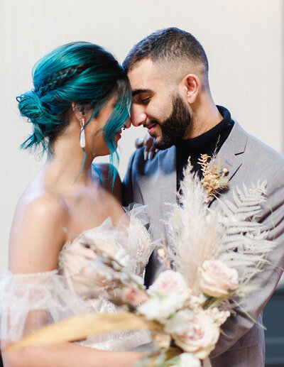 jaime-ta-creative-indoor-wedding-portland-bride-kissing-groom-ladyjmemories