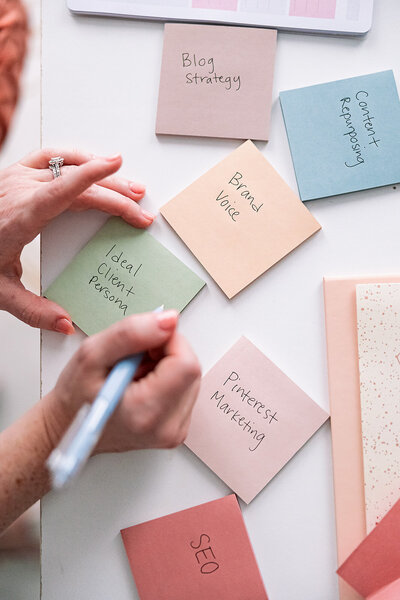 Stephanie Seija Content Marketing - hands writing marketing post-it notes