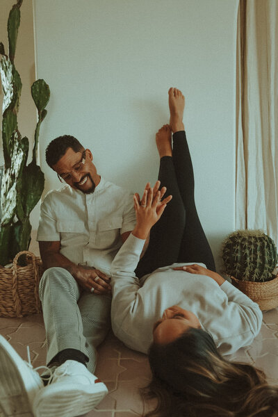 Couple sharing a cozy moment together during an in-home session in Seattle, photographed by Bare Bones Photo