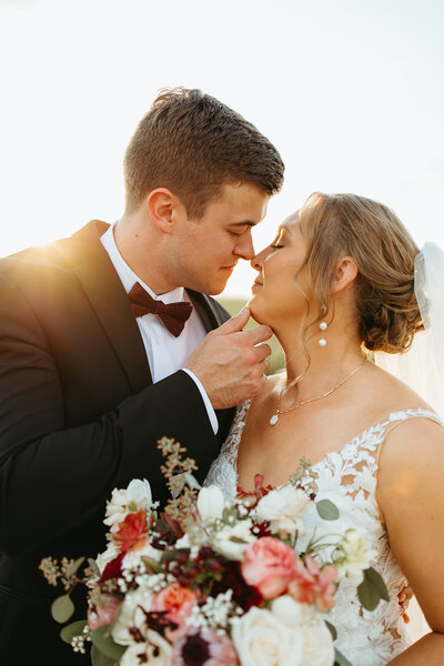 Bride and Groom pose for sunset photos in Wichita Ks with Ashley Cole Photography