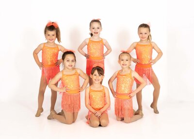 kindergarteners in coral costumes posed and ready for pictures