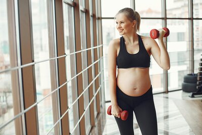 Pregnant woman with weights