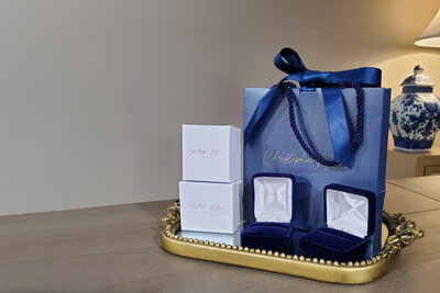 Custom luxury designer ring packaging with blue shimmer bag
