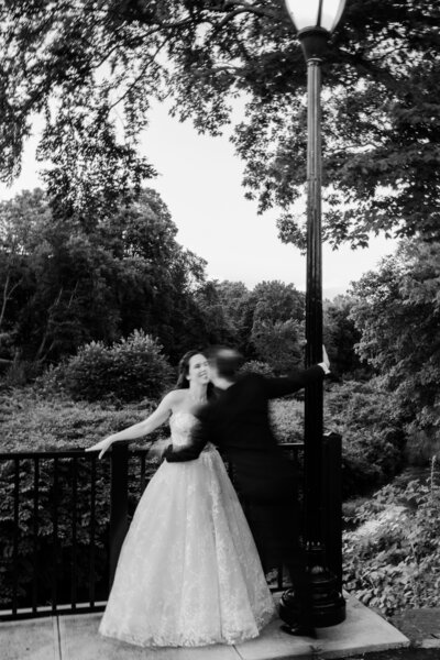 a black and white photo of a bride and groom