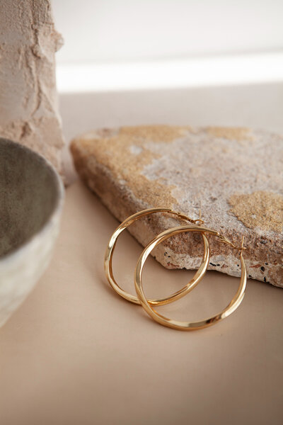 high-angle-aesthetic-golden-earrings-arrangement (1)