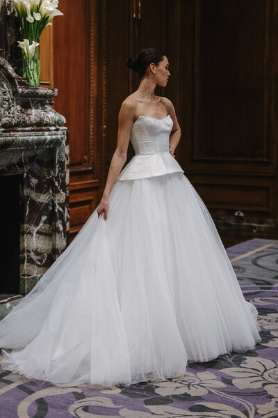 Mikado and tulle drop waist peplum corset with tulle ball gown skirt.