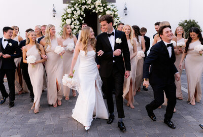 Bride and groom walk to wedding reception