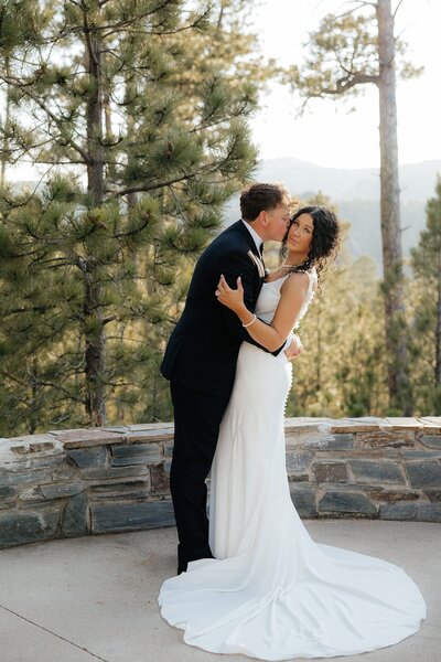 Terrel kissing Luisa on the cheek at their South Dakota Elopement.