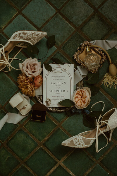 moody art deco wedding flat lay 