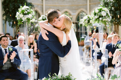 bride and groom hugging after just getting married at tortworth hall