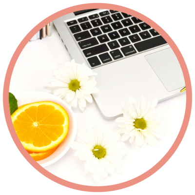 laptop with oranges and flowers