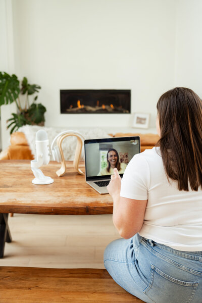 Chantal Hewitt wearing a white shirt and jeans coaching a parent of an autistic child virtually on her laptop - Family Autism Support Coach at Chantal Hewitt Coaching6