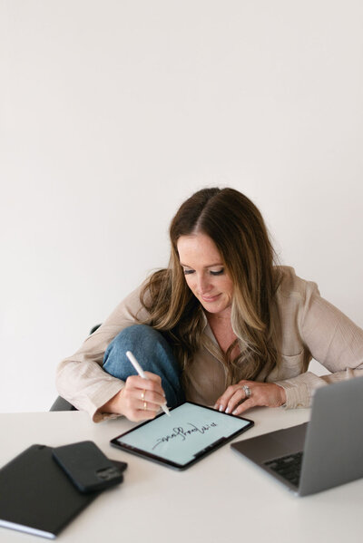 Woman drawing on an iPad