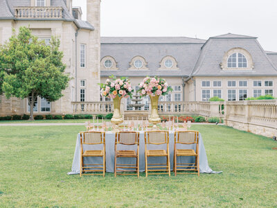 blue, pink, and green tablescape on lawn of The Olana in Hickory Creek, Texas