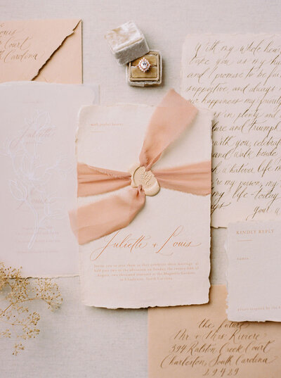 Blush wedding invitations with a rosy silk ribbon and pink wax seal from Dominique Alba