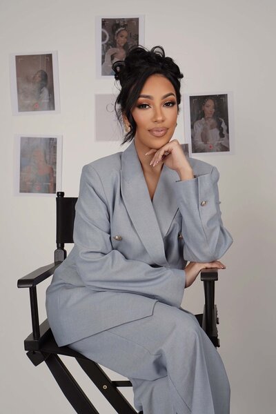 High-end NYC bridal makeup artist with elegant outfit and full glam kit ready for a wedding day session.