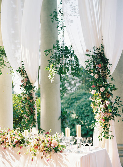 flowers on drapes with chandelier