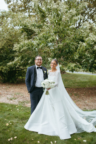 Luxury tented wedding with neutral palette and rattan details